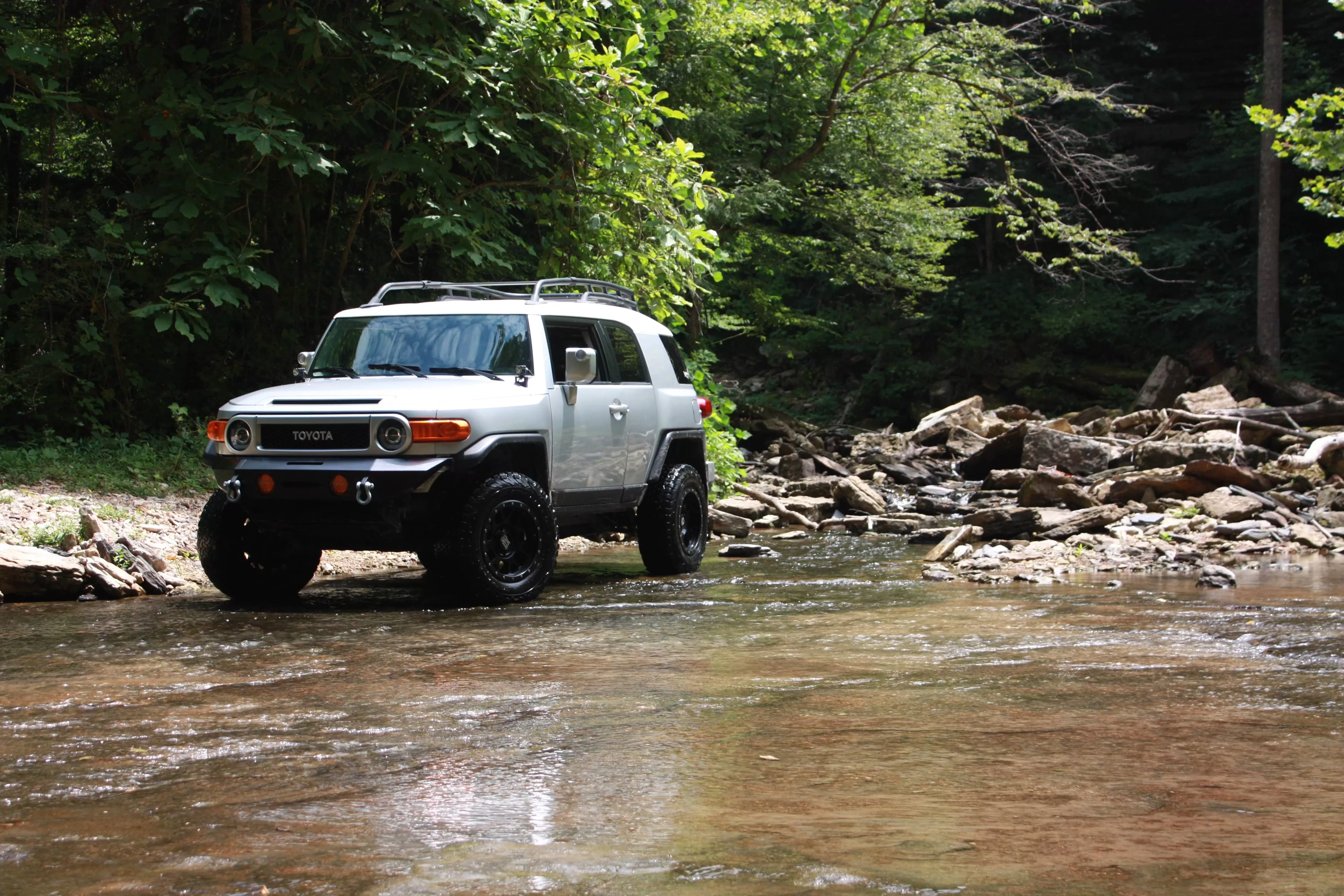 Toyota jeep on the river