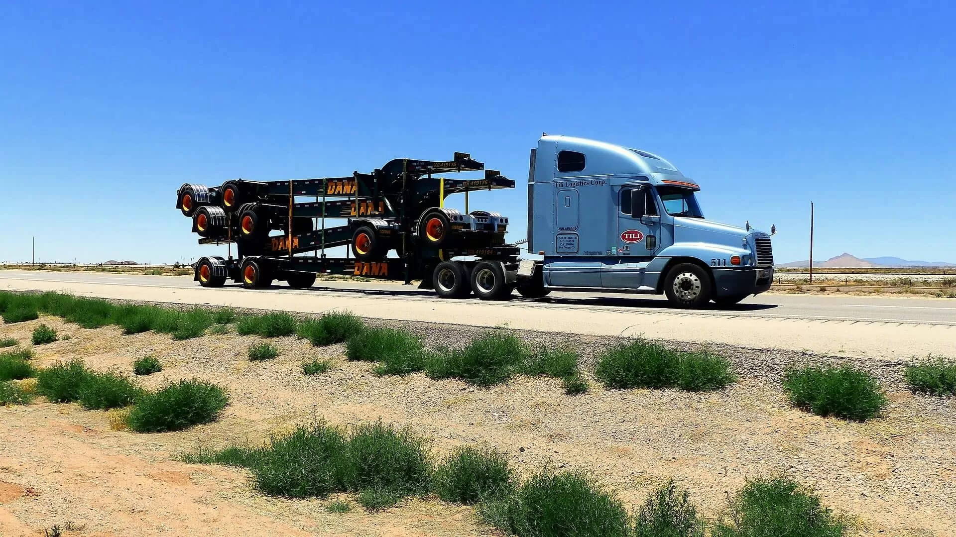 Truck with loaded trailers