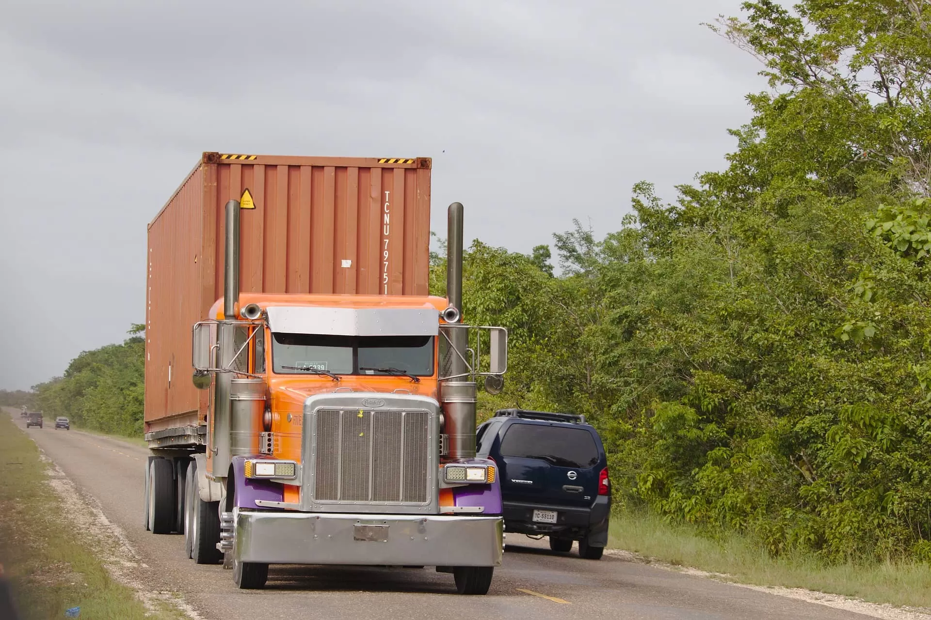 Orange truck on the road