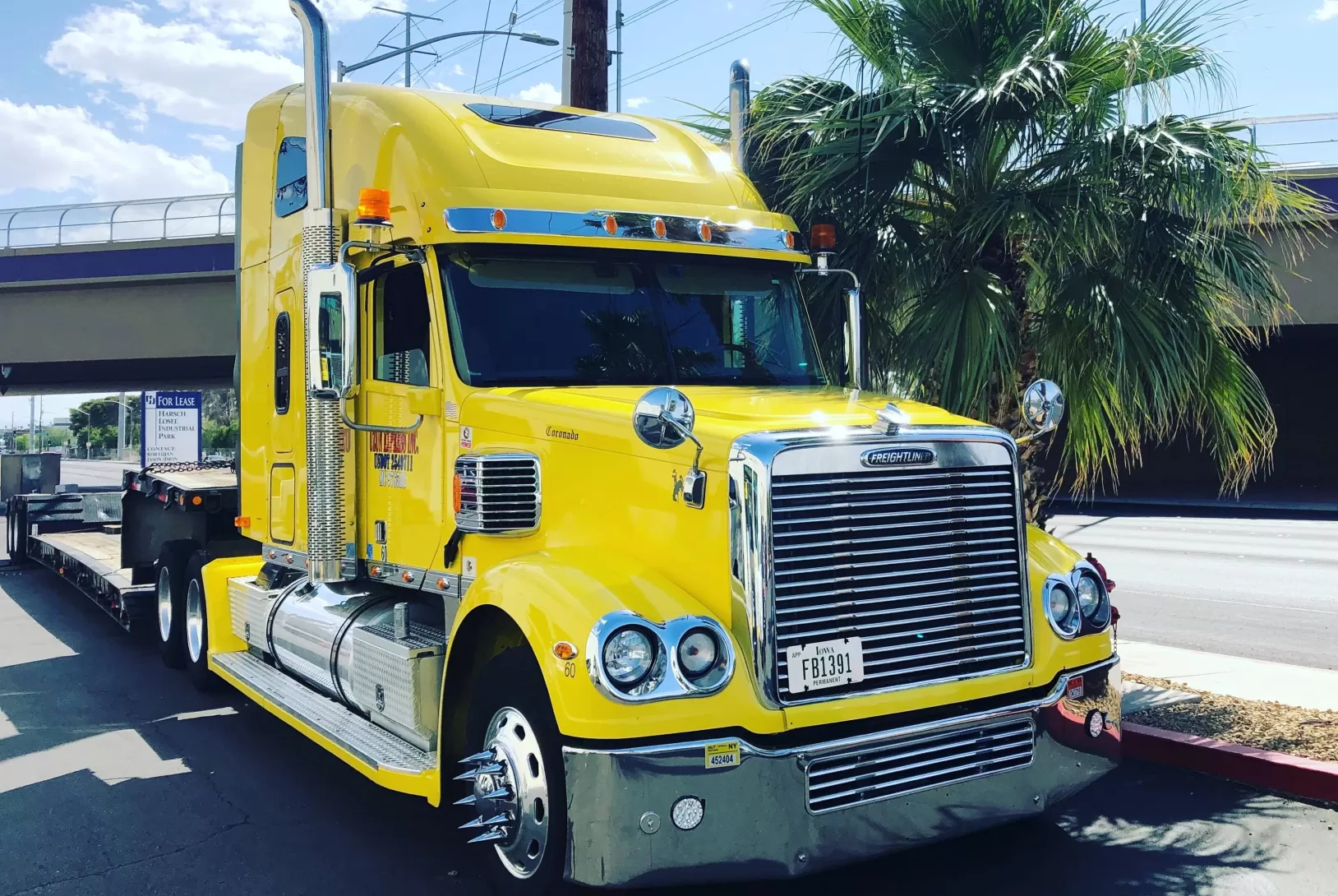 Yellow freightliner truck