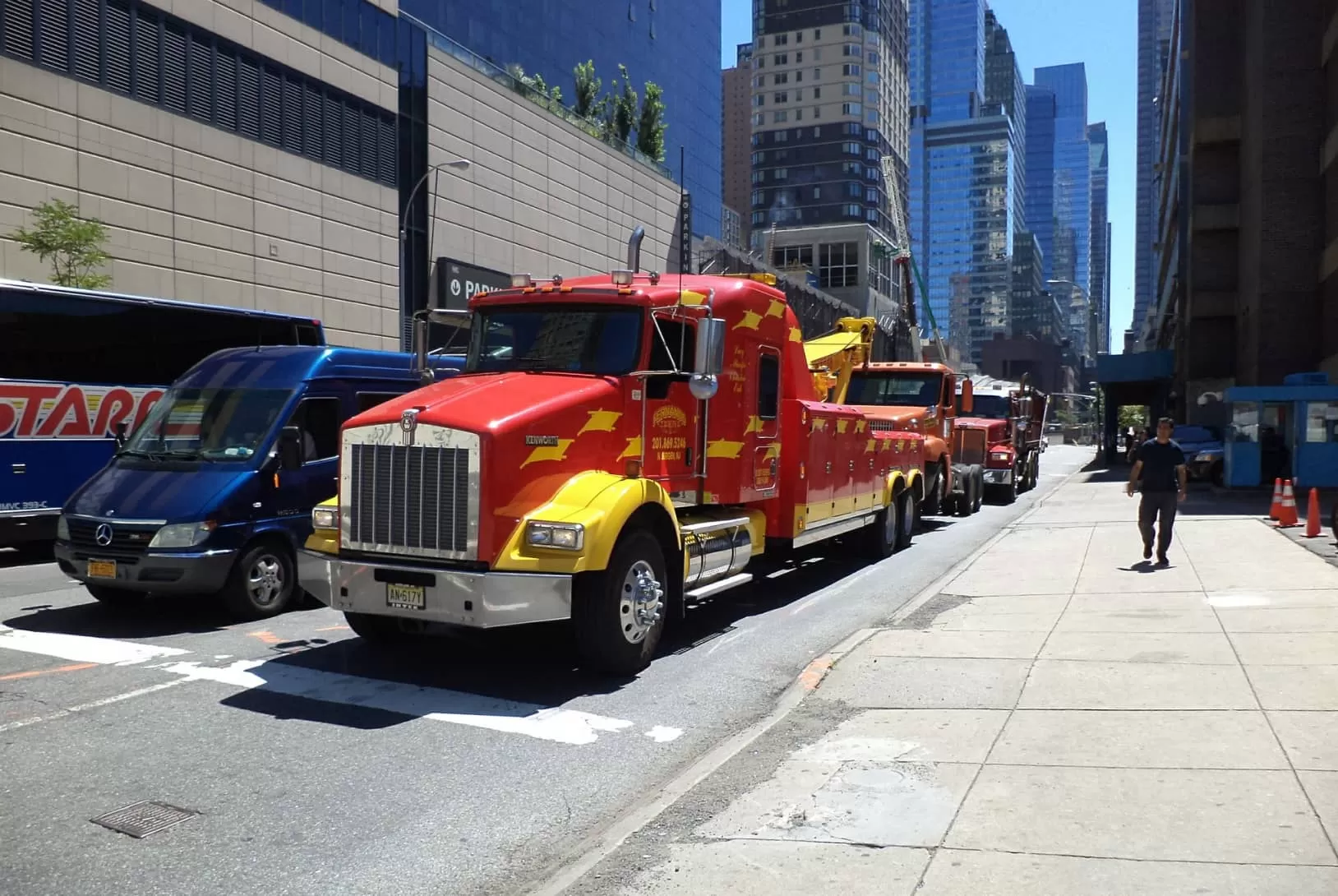 Red Kenworth trucks on the streets of the city