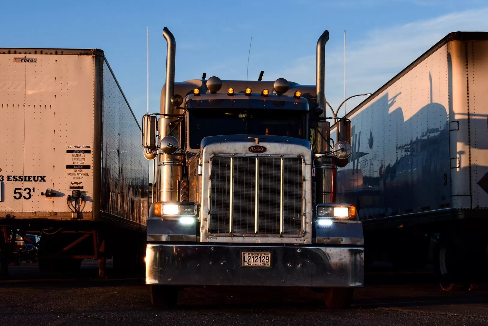 Peterbilt truck on the truck parking with turned front lights