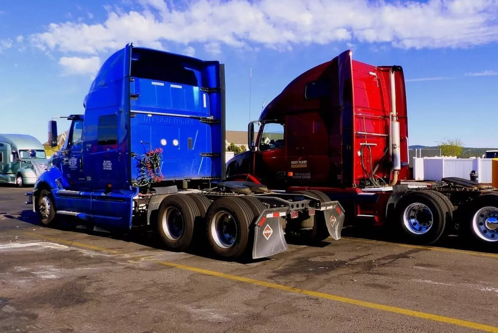 Blue and Red trucks without trailers