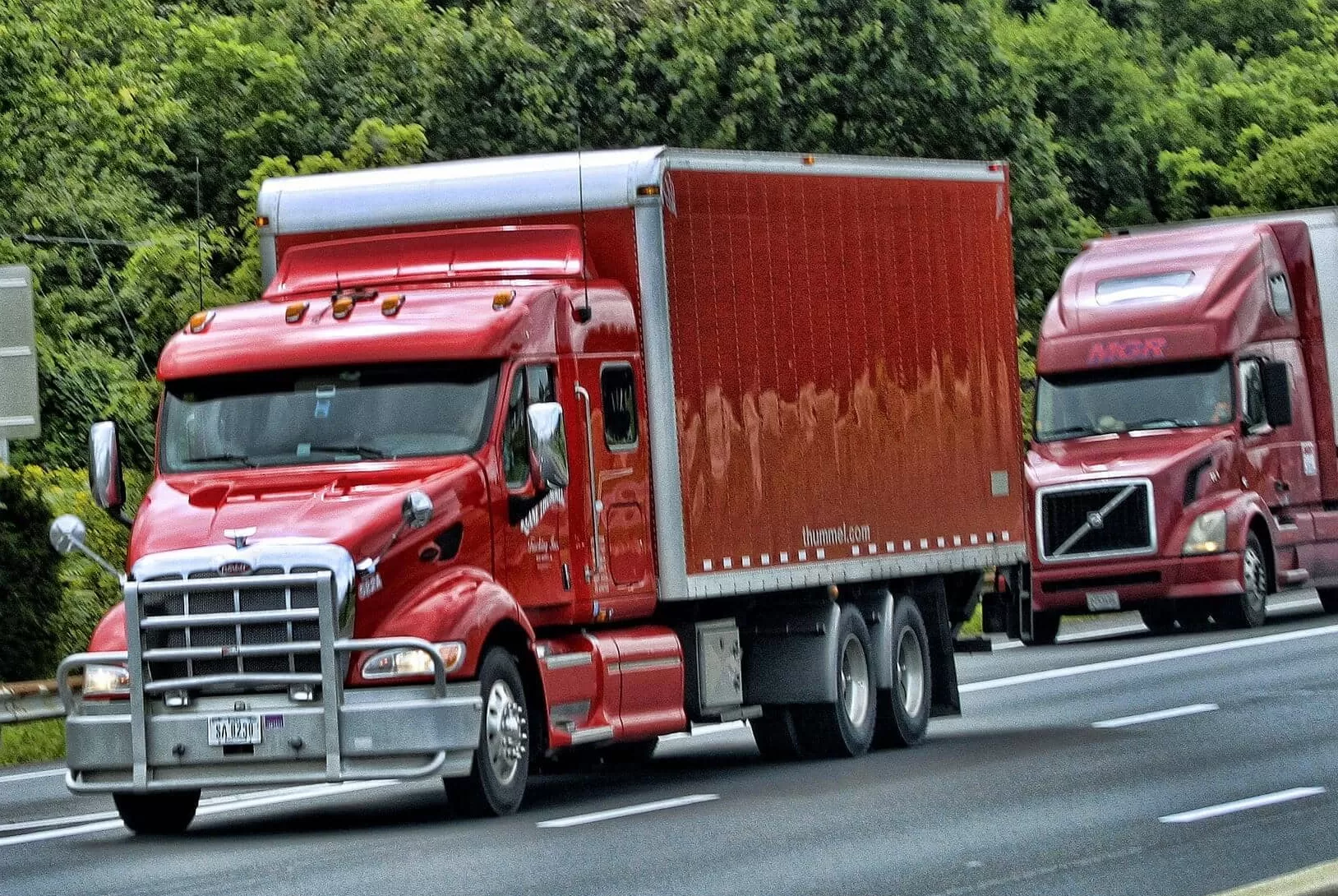 Red Peterbilt truck with Volvo Truck