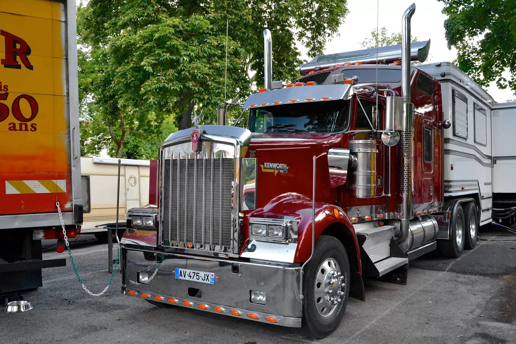 Red Kenworth truck with home trailer