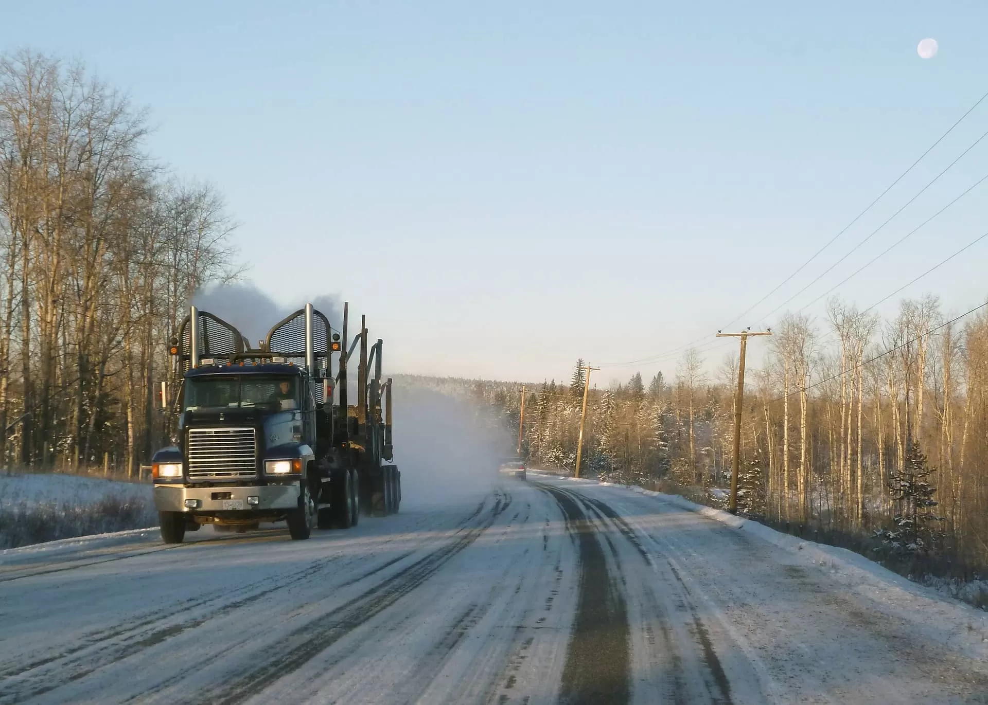 Black truck on snovy road