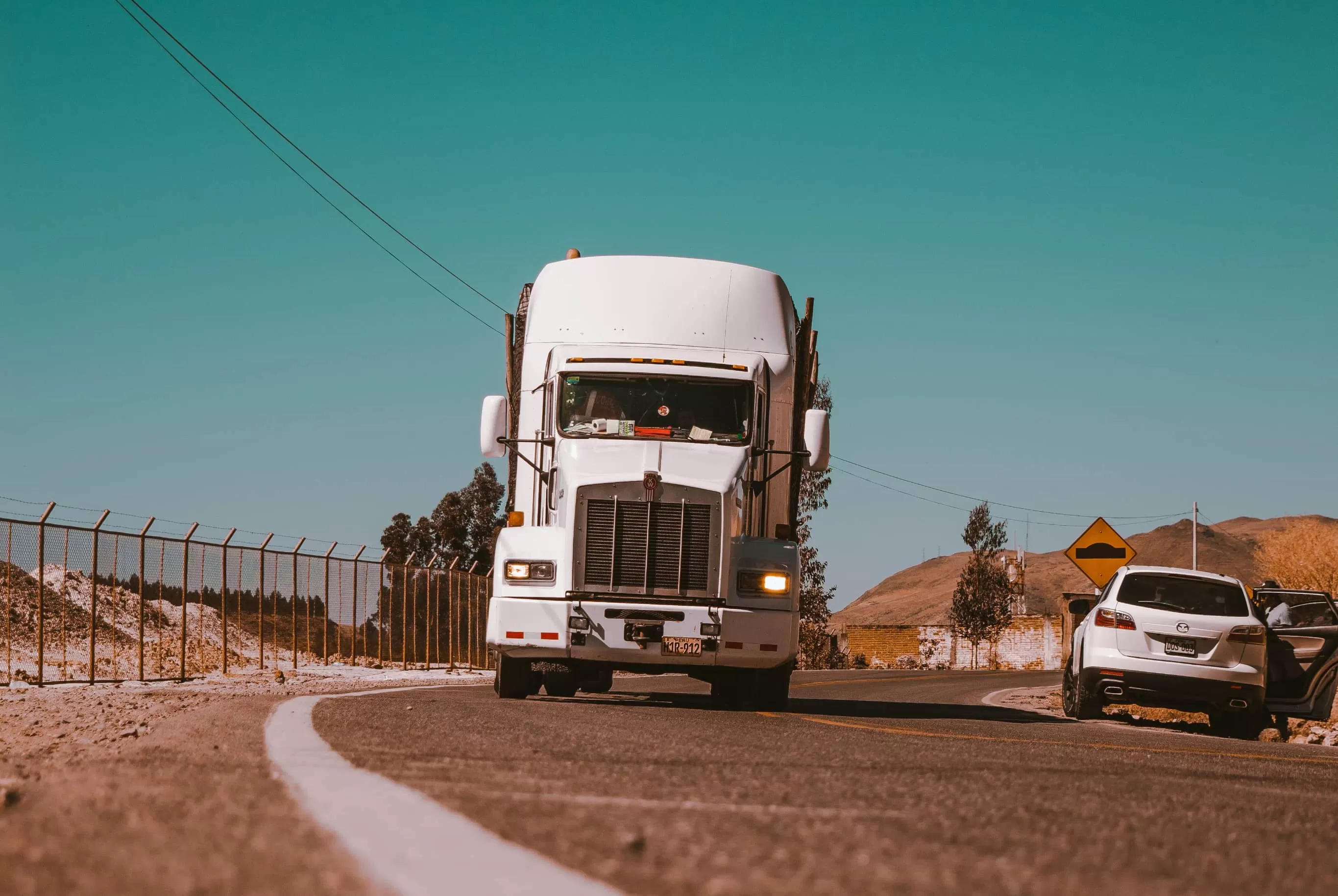 White truck KenWorth on the road