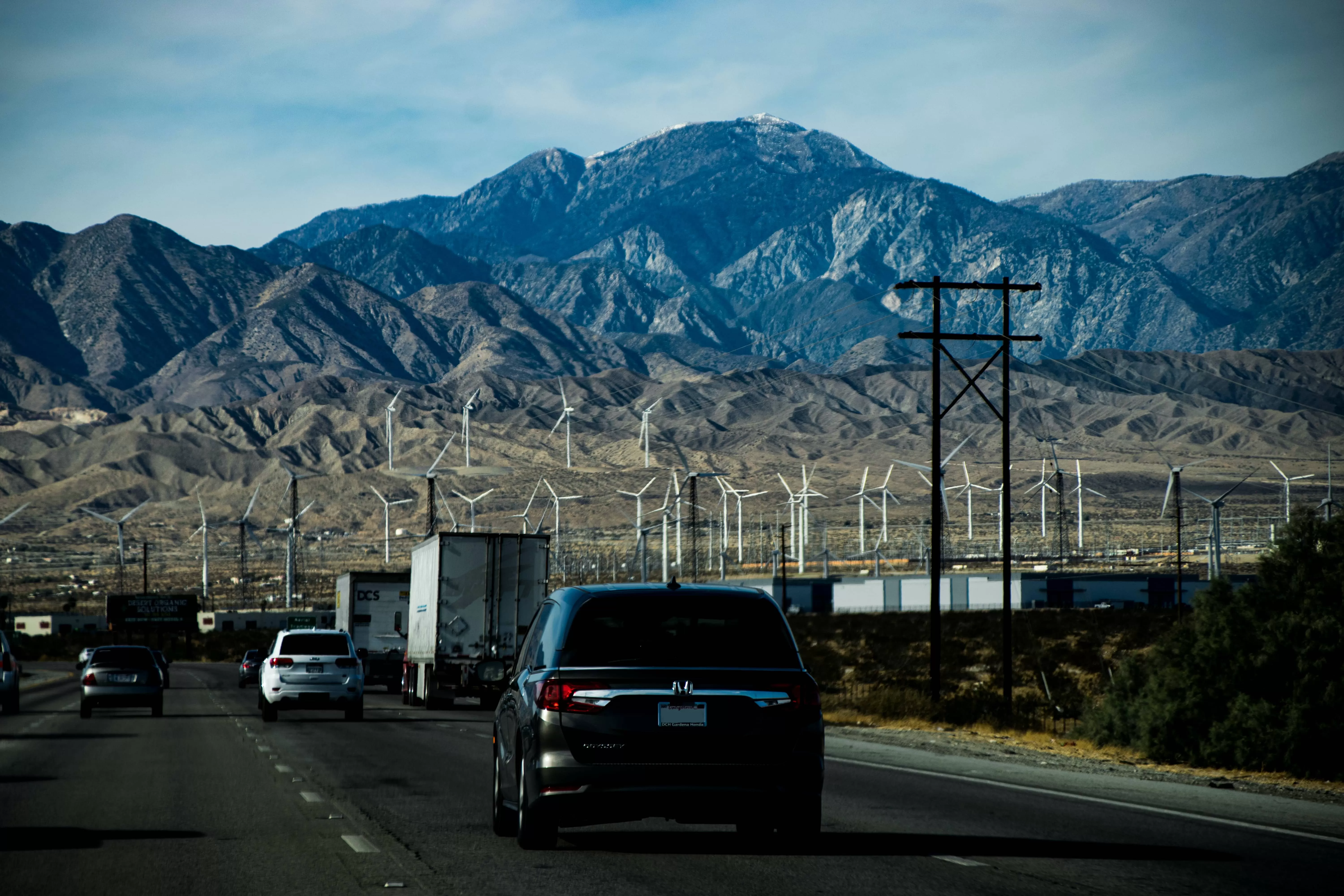 Road with trucks and cars