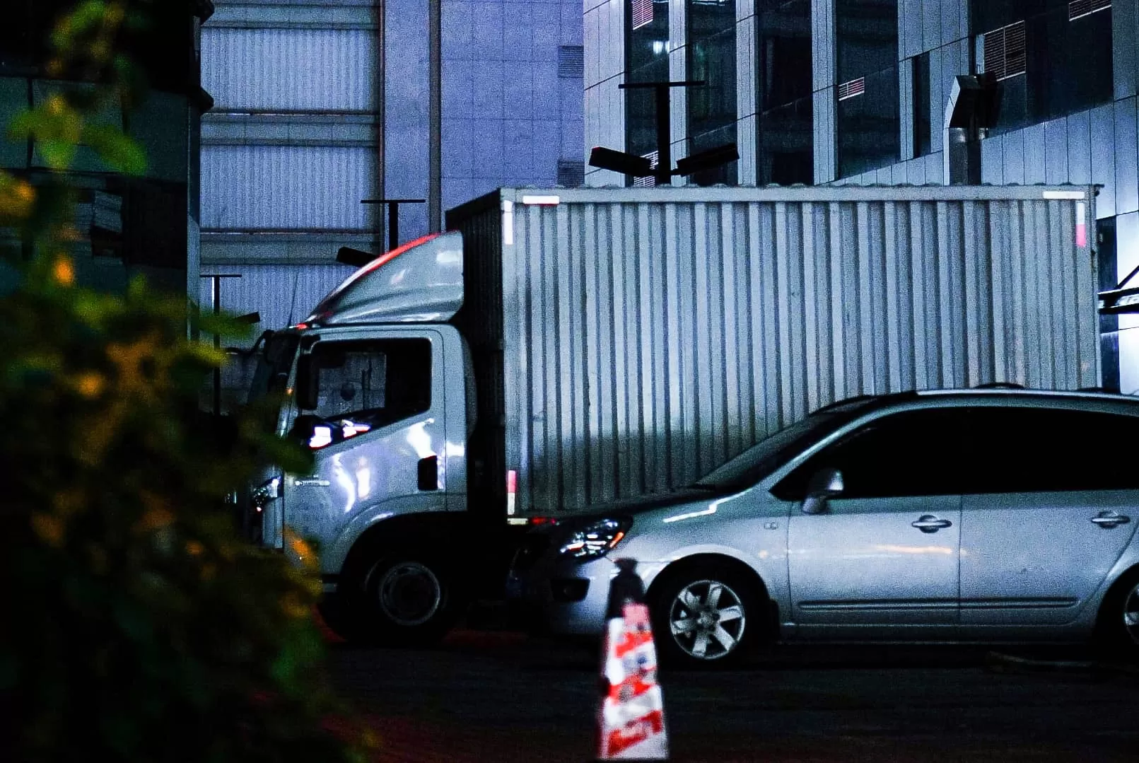 Night photo of truck and car