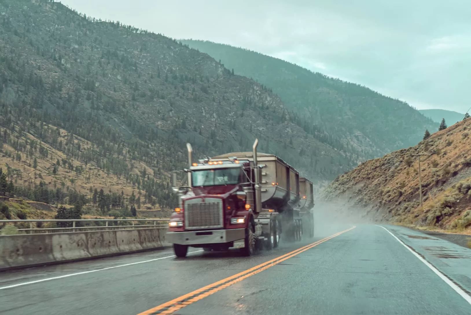 The purple truck goes up the road