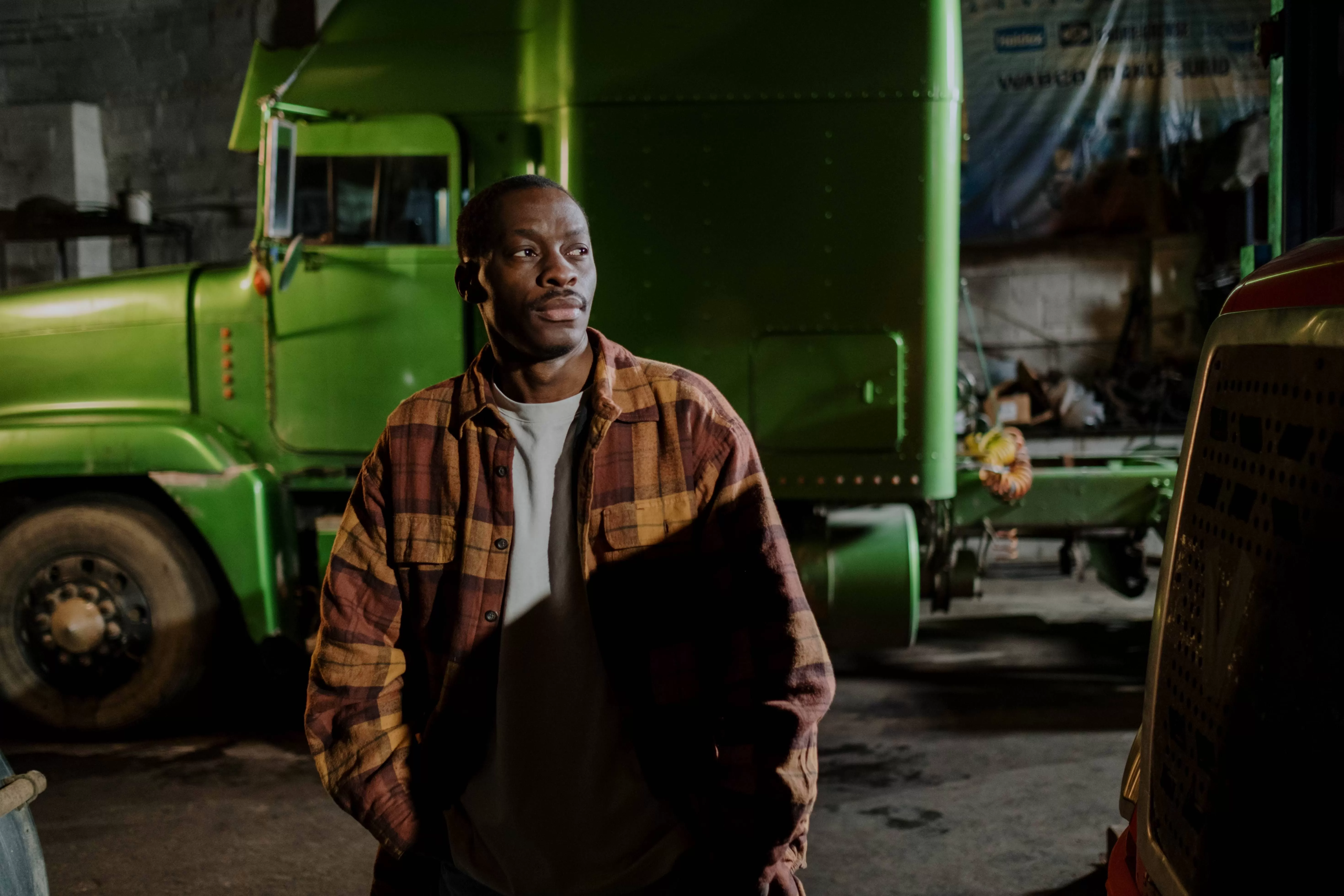 Truck driver on green truck background