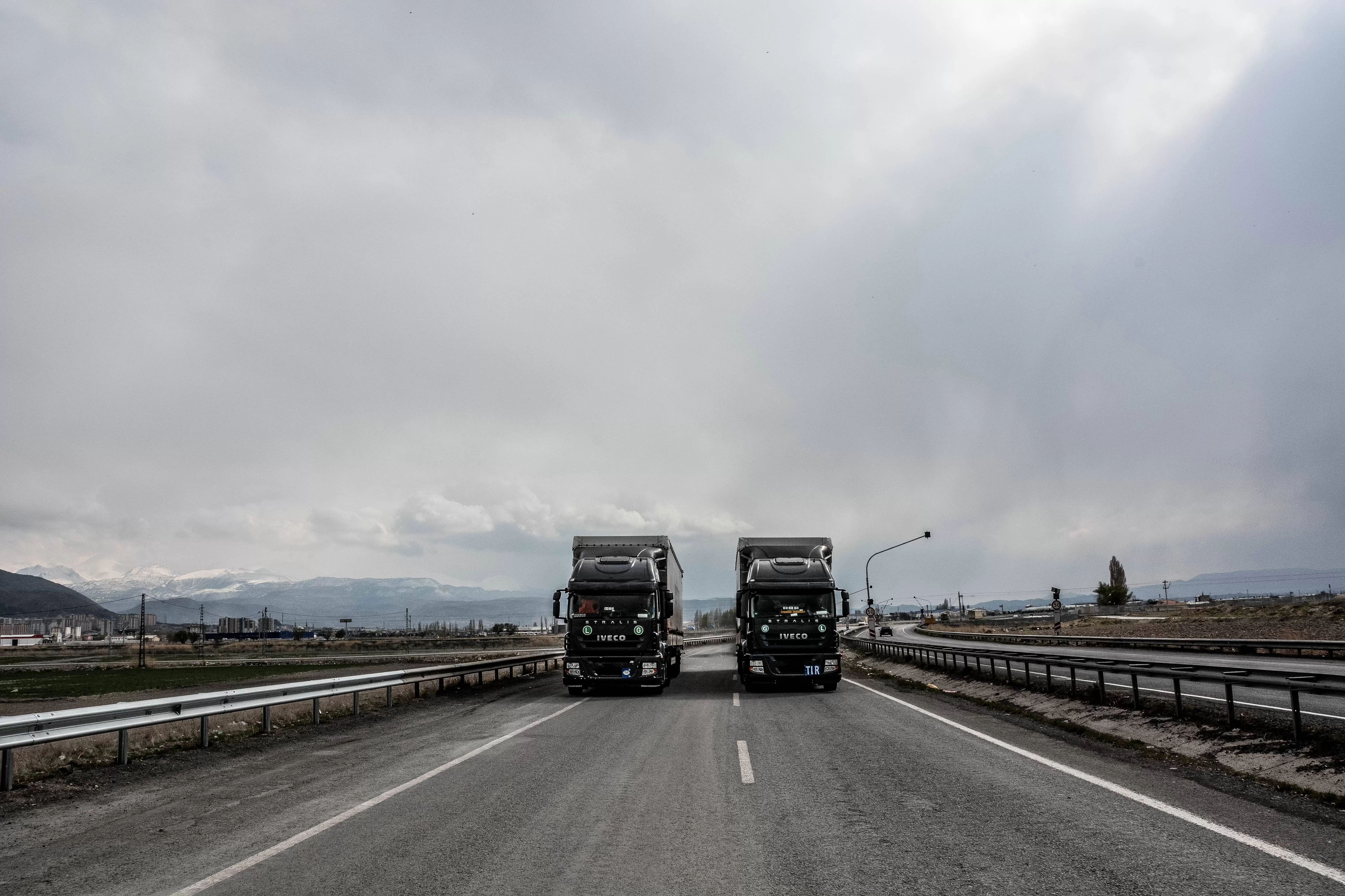 Two Iveco trucks on the road