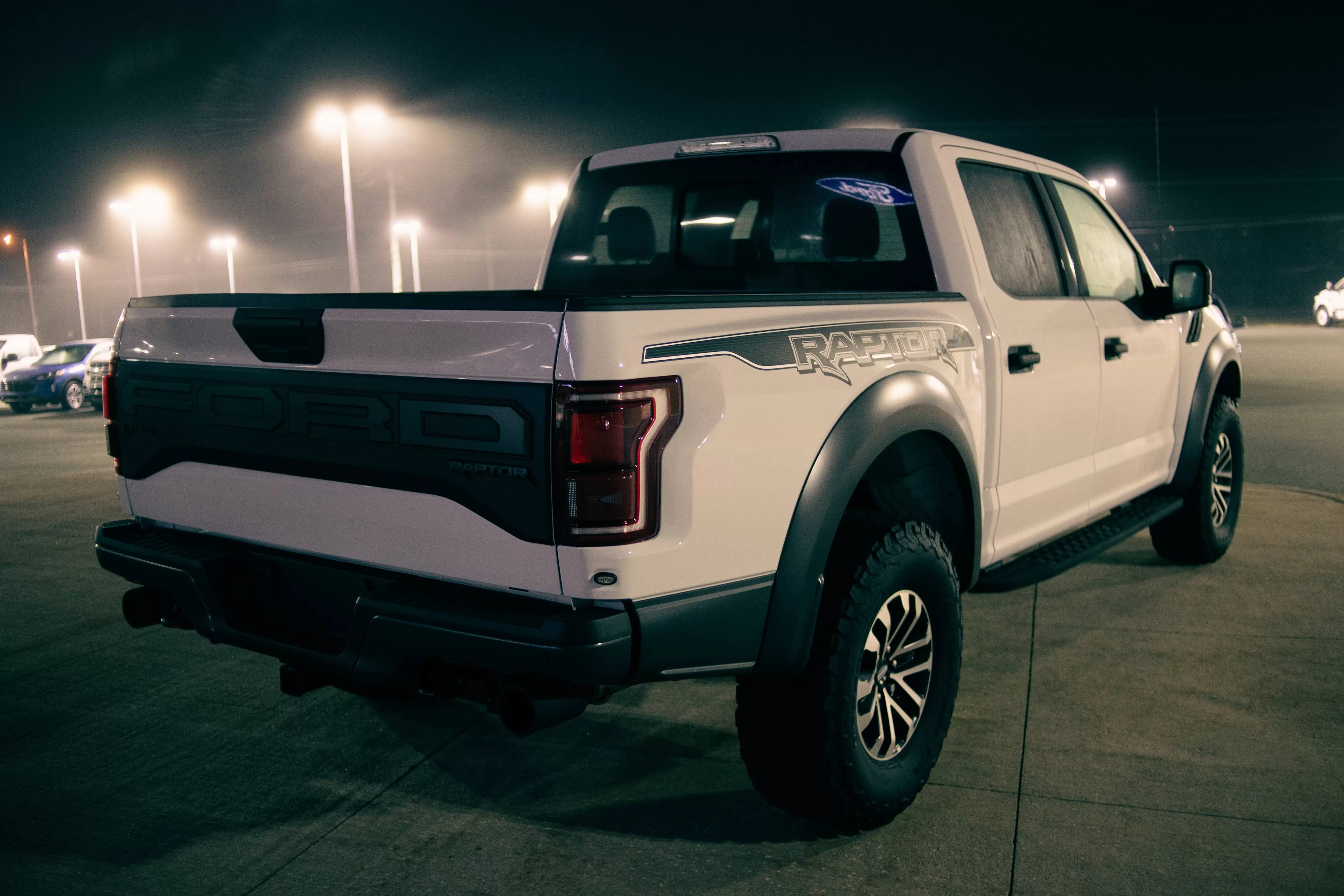 White Ford Raptor on parking