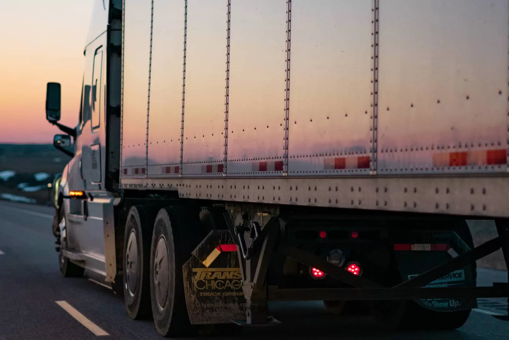 Photo of left side of truck on the road