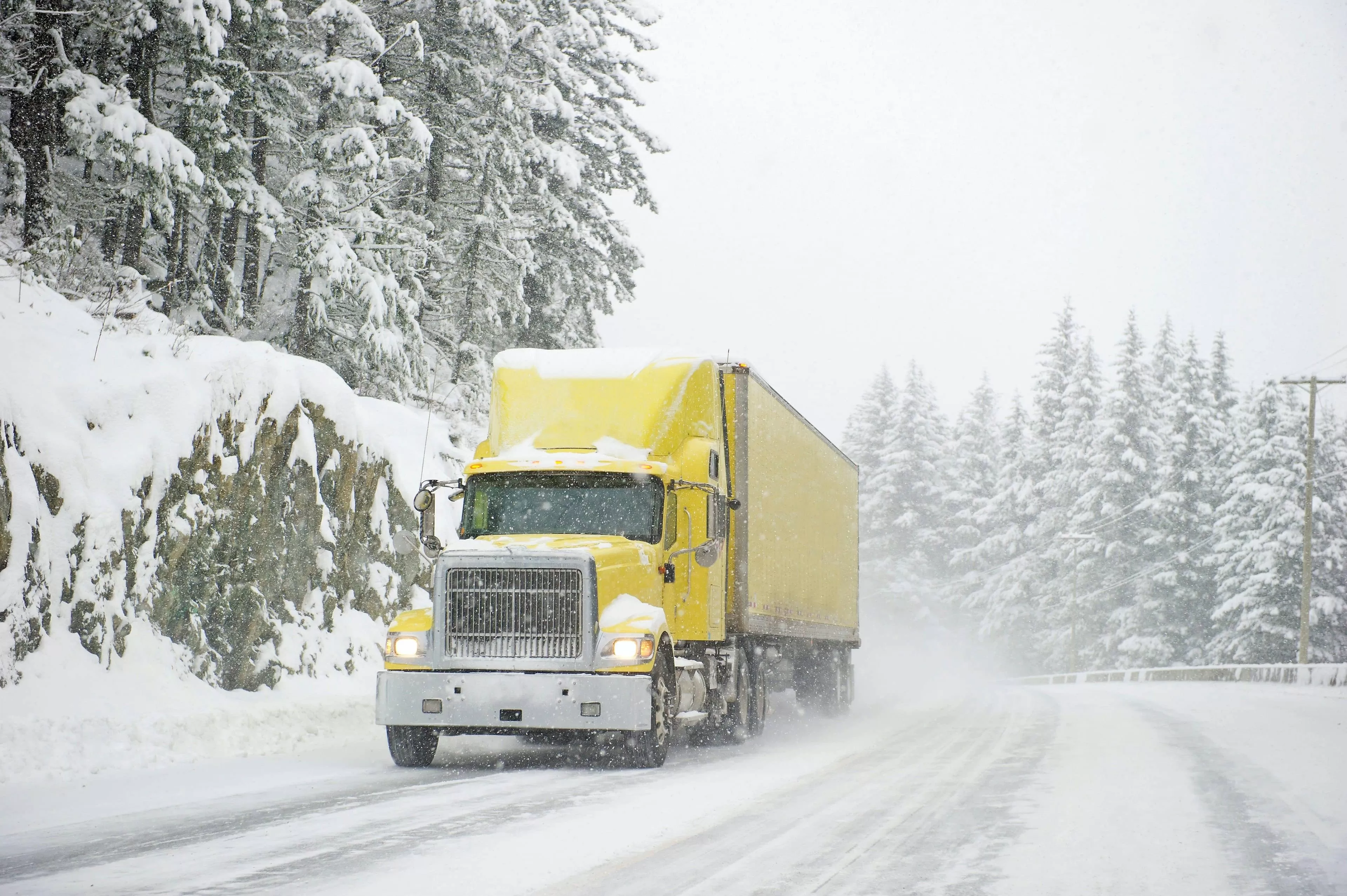 yellow truck in snowy weather
