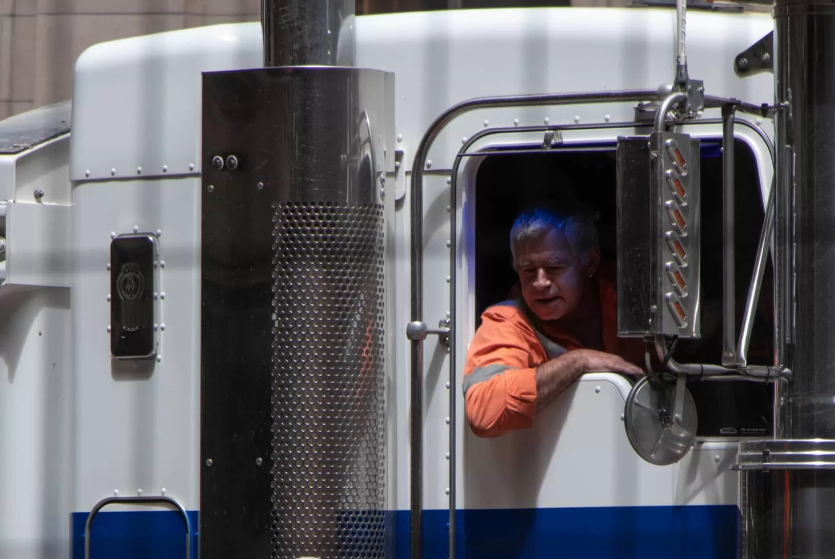 Truck driver inside cabin of truck