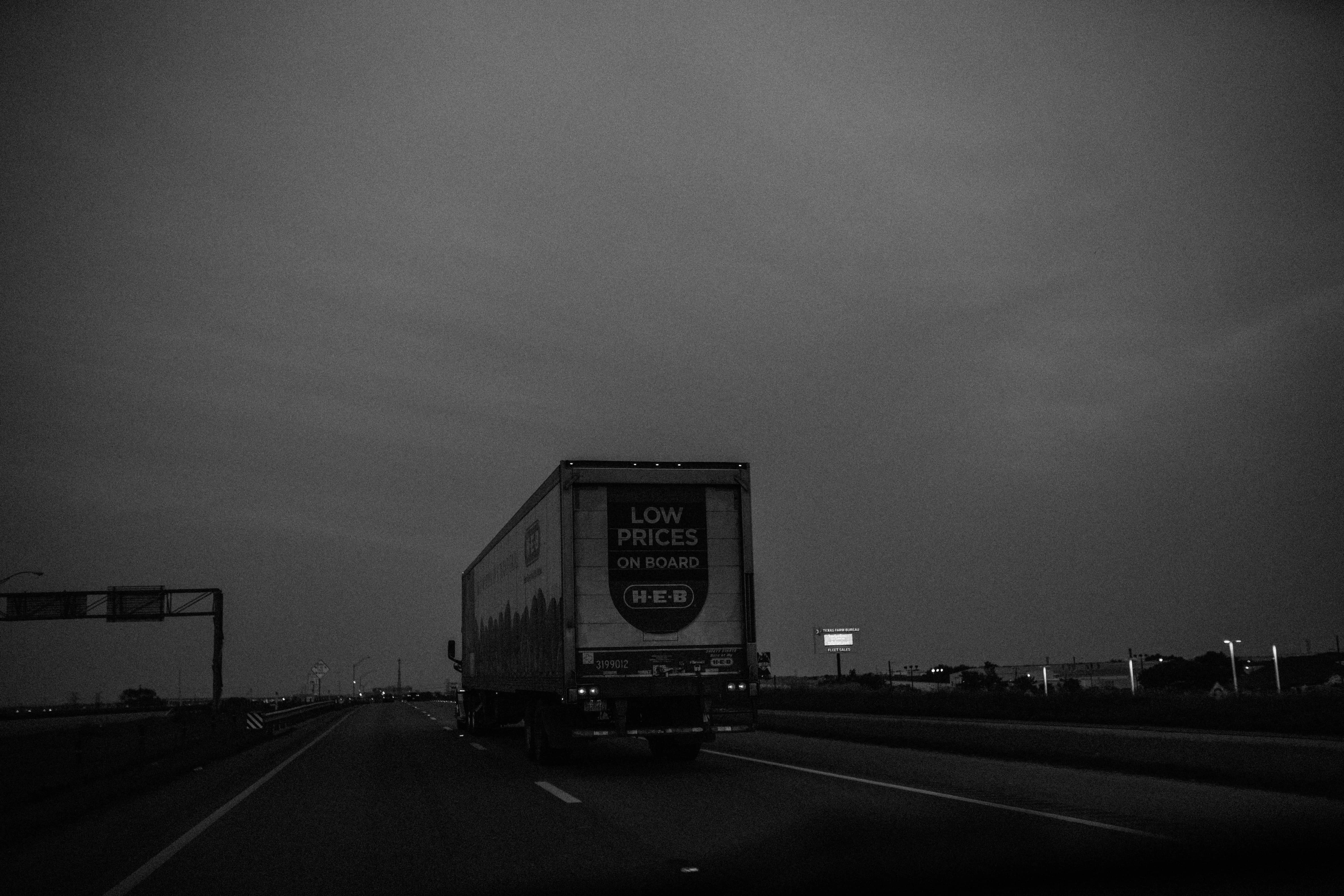 Truck on the road in grayscale