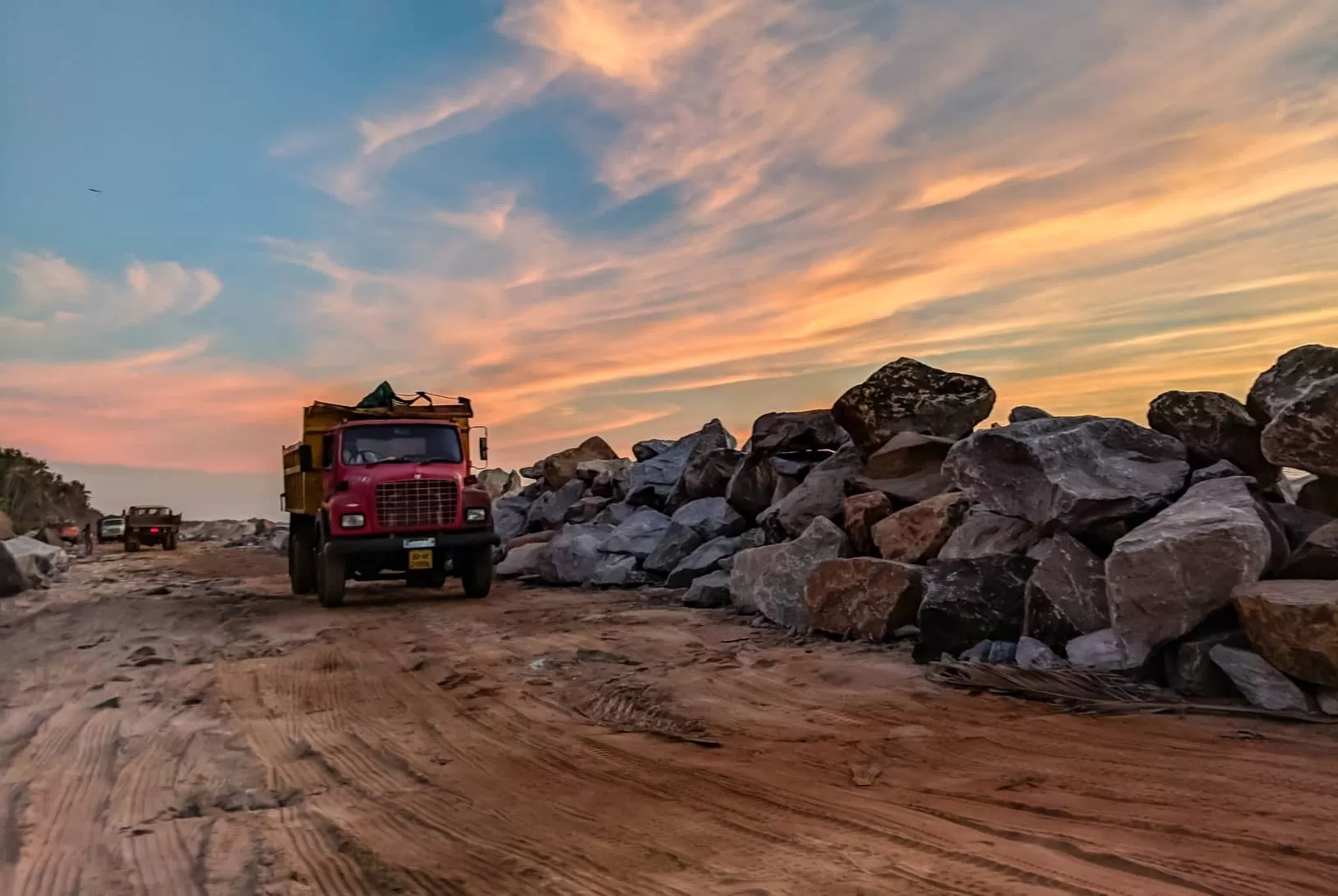 A truck at the quarry is loaded with stones