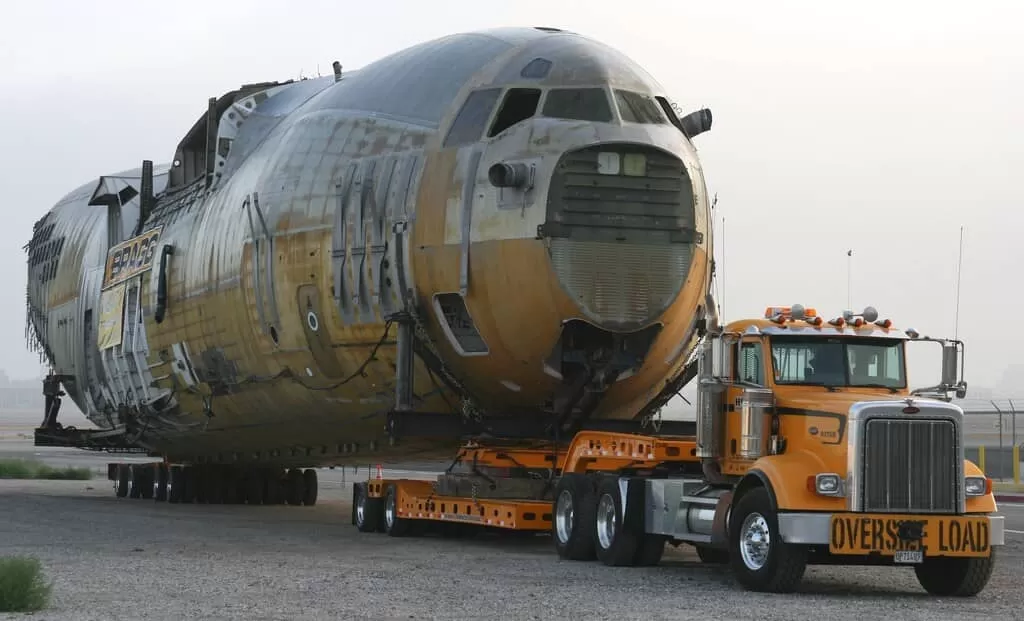 orange peterbilt truck overside load