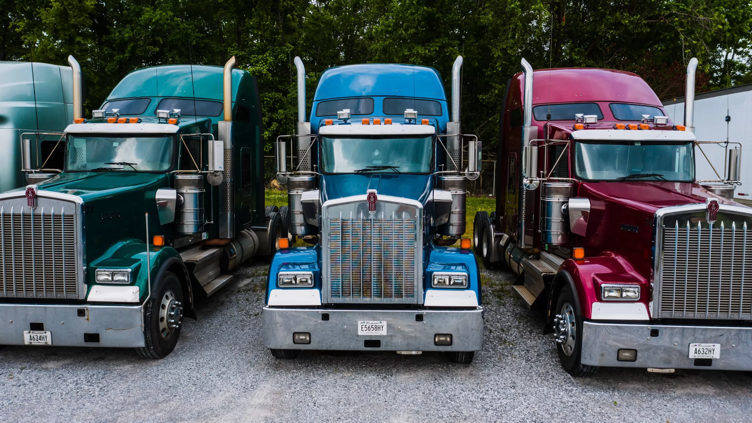 photo of three kenworth trucks scaled