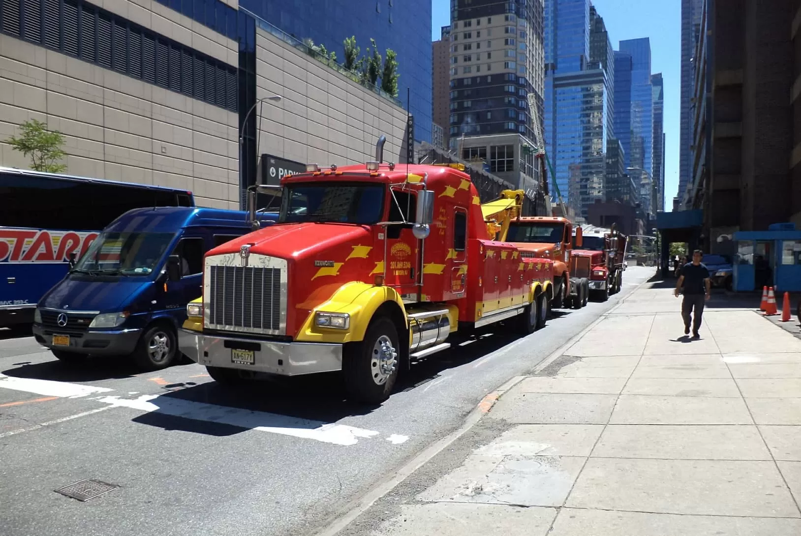 red kenworth trucks on the streets of the city