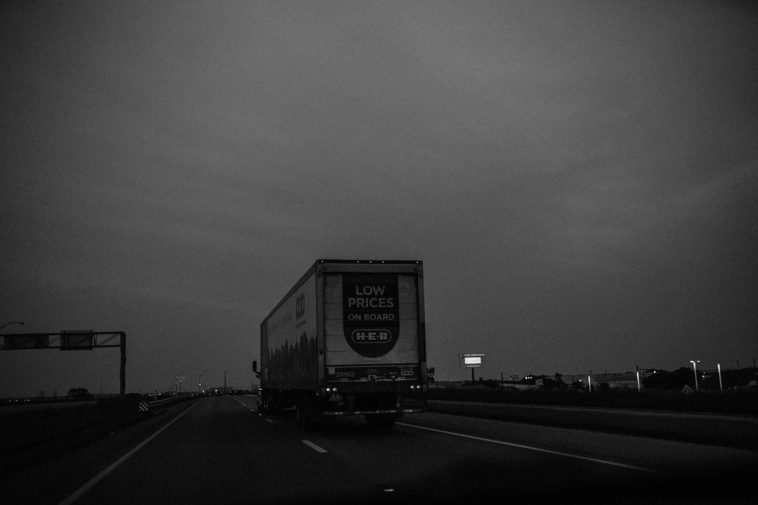 truck on the road in grayscale scaled