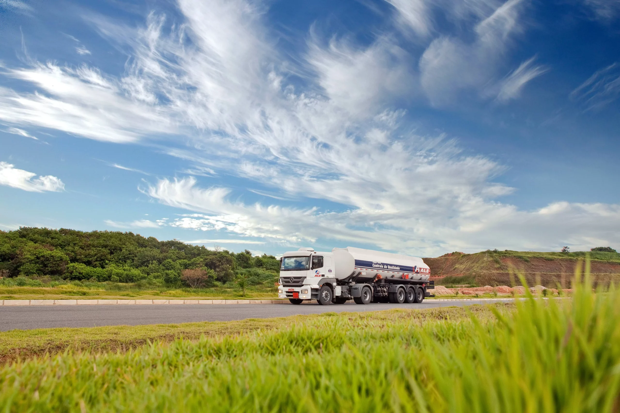 white tanker on the road scaled